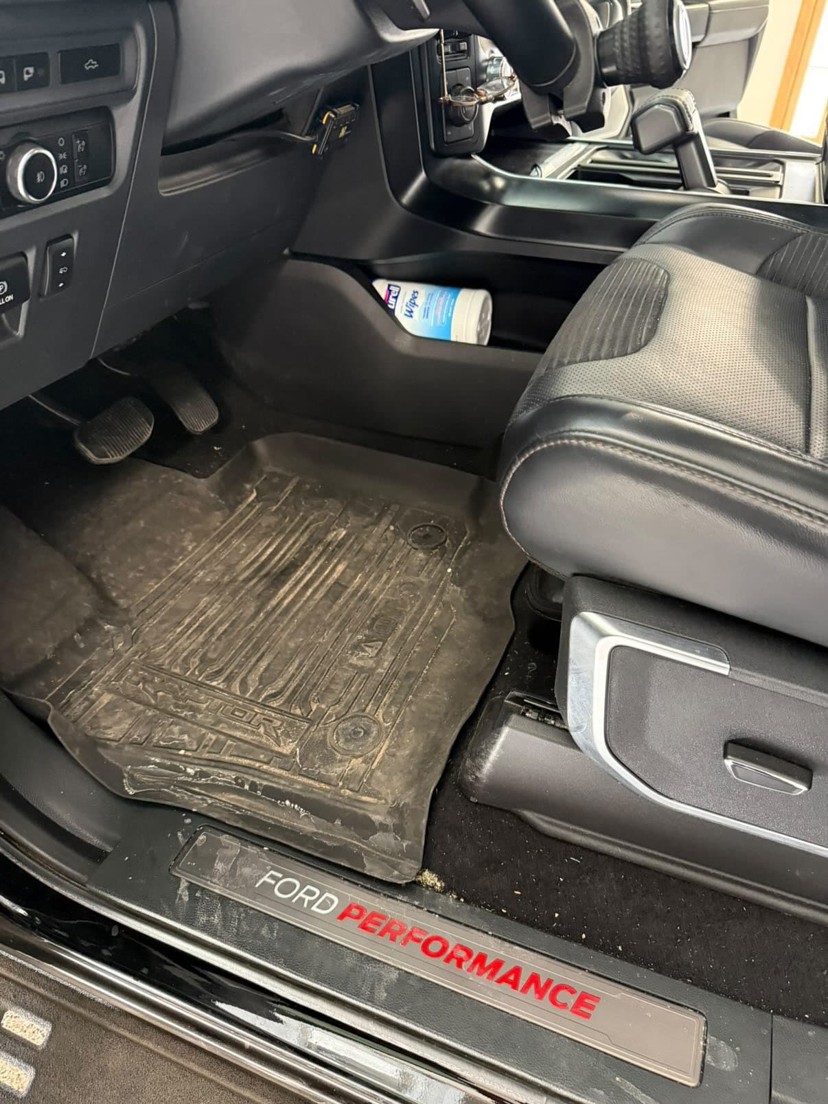Ford Raptor dirty floor mats before detail